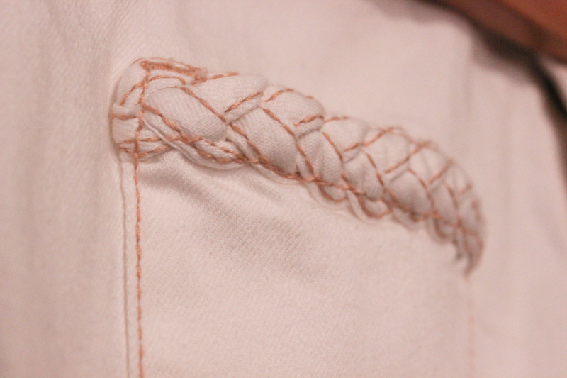 Braided denim detailing on the pockets and waistband.